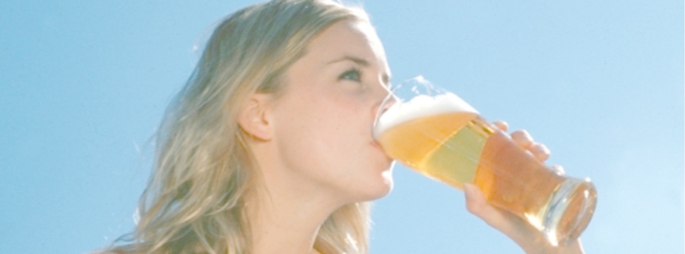 A woman drinks an alcoholfree beer