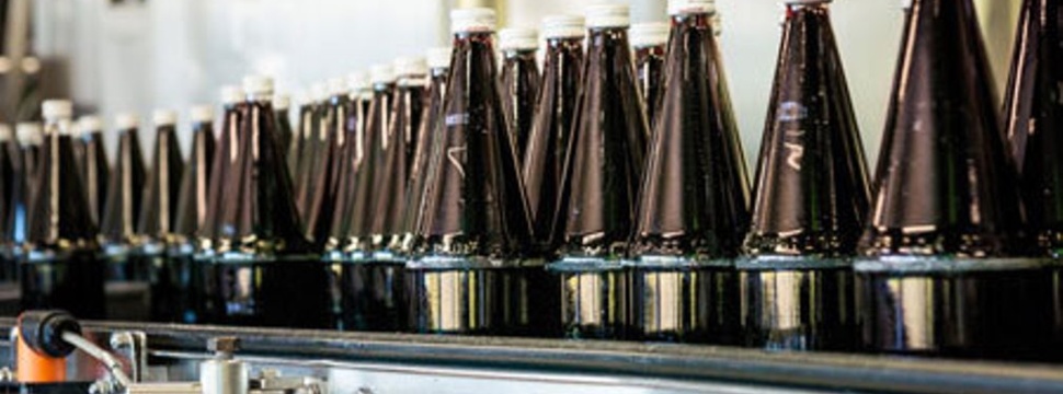 Juice bottles on a conveyor belt