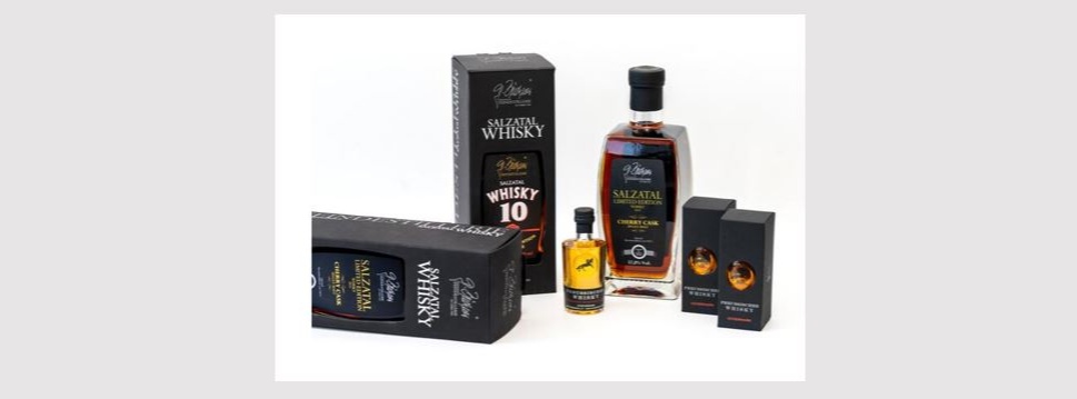 Black recycled paper packaging for “Preussischer Whisky” and “Salzatal Whisky”