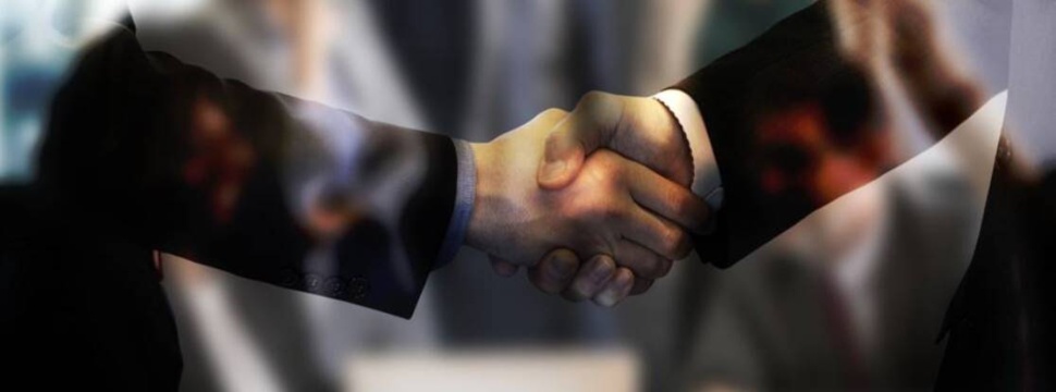 Job placement in the beverage industry: Handshake between to persons.